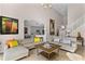 Open living room with sectional sofa, coffee table, and view of the kitchen at 8614 La Isla Dr, Kissimmee, FL 34747