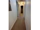 Hallway with access to bedrooms and storage closet at 8968 California Palm Rd, Kissimmee, FL 34747
