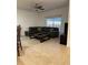 Spacious living room with sectional sofa and coffee table at 8968 California Palm Rd, Kissimmee, FL 34747
