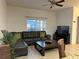Comfortable living room with a sectional sofa and large TV at 8968 California Palm Rd, Kissimmee, FL 34747