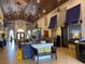 Community clubhouse lobby with comfortable seating and cinema at 8968 California Palm Rd, Kissimmee, FL 34747