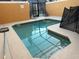 Community pool with a shallow end and safety fence at 8968 California Palm Rd, Kissimmee, FL 34747