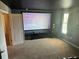 Home theater room with projector and screen at 9158 Scramble Dr, Davenport, FL 33896