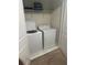 Convenient laundry room with washer, dryer, and shelving at 9158 Scramble Dr, Davenport, FL 33896