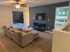 Upstairs living room with plush seating area, perfect for relaxation or movie nights, with tranquil paint colors at 9158 Scramble Dr, Davenport, FL 33896