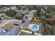 Aerial view showcasing home with solar panels and a private pool nestled in a fenced backyard at 927 Mare Bello Dr, Winter Park, FL 32792