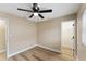 Cozy bedroom with a ceiling fan and a closet space, perfect for relaxation at 927 Mare Bello Dr, Winter Park, FL 32792