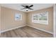 Bright bedroom with dual windows that provide lots of natural light, with a view of the surrounding neighborhood at 927 Mare Bello Dr, Winter Park, FL 32792