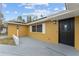 Inviting entrance featuring a modern black front door and brick accents at 927 Mare Bello Dr, Winter Park, FL 32792