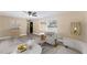 Bright living room featuring modern decor, stylish seating, neutral walls, and sleek floors at 927 Mare Bello Dr, Winter Park, FL 32792