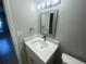Bathroom featuring a modern vanity, providing a clean and updated look in a well-lit space at 1014 Plantation Dr # A9, Kissimmee, FL 34741