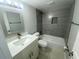 Bathroom with updated vanity and tiled shower/tub combo, offering a clean and modern aesthetic at 1014 Plantation Dr # A9, Kissimmee, FL 34741