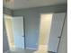 Bedroom with two closets and neutral wall paint at 1014 Plantation Dr # A9, Kissimmee, FL 34741