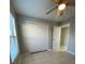 Spacious bedroom with ceiling fan and access to another room at 1014 Plantation Dr # A9, Kissimmee, FL 34741