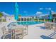 Relaxing community pool area with tables and umbrellas at 1014 Plantation Dr # A9, Kissimmee, FL 34741
