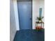 Condo entrance with blue door and welcome decor at 1014 Plantation Dr # A9, Kissimmee, FL 34741
