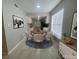 Bright dining room with adjacent kitchen, white cabinets, and modern lighting at 1014 Plantation Dr # A9, Kissimmee, FL 34741