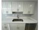 Kitchen sink featuring white cabinets, stainless steel appliances, a granite countertop, and plenty of workspace at 1014 Plantation Dr # A9, Kissimmee, FL 34741