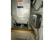 Mechanical room with water heater and AC unit at 1014 Plantation Dr # A9, Kissimmee, FL 34741