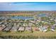 Stunning aerial view of homes in a lake community surrounded by natural wetlands and lakes at 127 Terra Vista Ln, Kissimmee, FL 34759