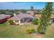 Aerial view of home with screened lanai and manicured landscaping at 127 Terra Vista Ln, Kissimmee, FL 34759