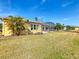 Landscaped backyard with a screened lanai, offering serene outdoor living at 127 Terra Vista Ln, Kissimmee, FL 34759
