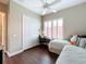 Bright bedroom with twin beds, work station, plantation shutters and a ceiling fan at 127 Terra Vista Ln, Kissimmee, FL 34759