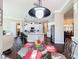 Open dining room with seating for four and view to a modern kitchen at 127 Terra Vista Ln, Kissimmee, FL 34759