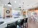 Bright open kitchen boasts an island with bar seating and stainless steel appliances at 127 Terra Vista Ln, Kissimmee, FL 34759