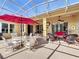 Large screened lanai featuring comfortable outdoor seating, perfect for relaxation at 127 Terra Vista Ln, Kissimmee, FL 34759