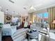 Open-concept living room seamlessly connects to the kitchen and outdoor patio at 127 Terra Vista Ln, Kissimmee, FL 34759