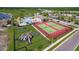 Aerial view of community amenities including pool, tennis courts, playground and landscaping at 1404 Lexington Avenue, Davenport, FL 33837