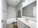 This bathroom features a shower over bath and a single sink at 1404 Lexington Avenue, Davenport, FL 33837