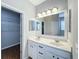 Bright bathroom with double sinks, vanity, and large mirror at 1404 Lexington Avenue, Davenport, FL 33837