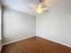 A spacious bedroom features hardwood floors and natural lighting at 1404 Lexington Avenue, Davenport, FL 33837