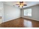 Spacious bedroom with hardwood floors and ceiling fan at 1404 Lexington Avenue, Davenport, FL 33837