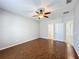 Large bedroom with hardwood floors and ceiling fan at 1404 Lexington Avenue, Davenport, FL 33837