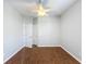Spacious bedroom with wood flooring and ceiling fan at 1404 Lexington Avenue, Davenport, FL 33837