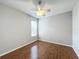 Bright bedroom with ceiling fan and wood-look flooring at 1404 Lexington Avenue, Davenport, FL 33837