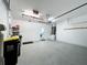 Spacious garage with high ceilings and epoxy flooring at 1404 Lexington Avenue, Davenport, FL 33837