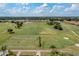 Scenic aerial view of a well-manicured golf course featuring lush green fairways and manicured putting greens at 1404 Lexington Avenue, Davenport, FL 33837