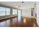 Spacious living room featuring hardwood floors, large windows, and an open floor plan at 1404 Lexington Avenue, Davenport, FL 33837