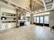 Elegant lobby featuring a stone fireplace, built-in shelving, tile flooring and coffered ceiling at 1404 Lexington Avenue, Davenport, FL 33837
