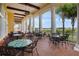 Inviting outdoor seating area with tables and chairs, overlooking a lush green golf course at 1404 Lexington Avenue, Davenport, FL 33837