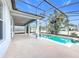 A beautiful screened in pool and covered patio perfect for outdoor entertaining at 1404 Lexington Avenue, Davenport, FL 33837