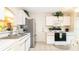 Functional kitchen with modern appliances, white cabinets, and ample counter space at 143 Hollingshead Loop, Davenport, FL 33896