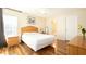 Comfortable main bedroom with hardwood floors and a large window offering natural light at 143 Hollingshead Loop, Davenport, FL 33896