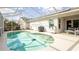 Refreshing enclosed pool area perfect for outdoor relaxation and entertaining guests at 143 Hollingshead Loop, Davenport, FL 33896