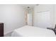 Minimalist bedroom with neutral walls, gray carpet, a closet and doorway at 1813 Castleton Dr, St Cloud, FL 34771
