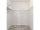 Walk-in closet with wire shelving providing ample storage space at 1813 Castleton Dr, St Cloud, FL 34771